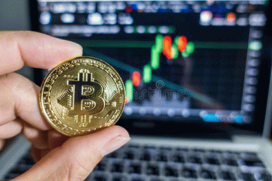 businessman-holding-golden-bitcoin-front-laptop-stock-exchange-graph-background-digital-money-concept-businessman-113405369